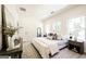 Bright bedroom features neutral decor, a large window, and a bed with decorative pillows at 185 Wadley Nw St, Atlanta, GA 30314