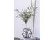 Stylized interior decor of geometric accents and a white flower vase atop decorative coffee table books at 185 Wadley Nw St, Atlanta, GA 30314