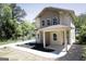 Charming two-story home featuring beige siding, a welcoming front porch, and a well-manicured front yard at 185 Wadley Nw St, Atlanta, GA 30314