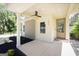 Cozy front porch with a ceiling fan, a decorative door and a manicured front garden at 185 Wadley Nw St, Atlanta, GA 30314