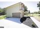 This home features an attached two-car garage and a newly paved driveway on a landscaped lot at 185 Wadley Nw St, Atlanta, GA 30314