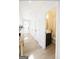 Bright hallway leading to a modern half bathroom with a sleek vanity and vessel sink at 185 Wadley Nw St, Atlanta, GA 30314