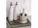 Stylish kitchen details with oil and vinegar bottles displayed on 'Magnolia Table' cookbook at 185 Wadley Nw St, Atlanta, GA 30314