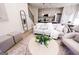 Cozy living room with modern decor open to the kitchen and stairway with black accents at 185 Wadley Nw St, Atlanta, GA 30314