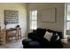 Inviting living room features a black sofa, modern desk, and natural light at 185 Wadley Nw St, Atlanta, GA 30314