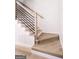 Modern stairway with wood treads, black metal railings, and white risers at 185 Wadley Nw St, Atlanta, GA 30314