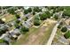 An aerial view highlights a neighborhood with homes near green space and water tower, showing a serene and attractive community at 30 Poplar St, Porterdale, GA 30014