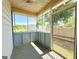 Enclosed porch with plenty of natural light and a relaxing atmosphere at 30 Poplar St, Porterdale, GA 30014
