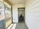 Screened-in porch leading to the interior of the home at 30 Poplar St, Porterdale, GA 30014