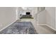 Open basement with indoor putting green, sofa, tv and carpet at 803 Baugh Springs Ln, Lawrenceville, GA 30044