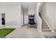 Spacious basement area featuring an indoor putting green and basketball arcade game for recreation at 803 Baugh Springs Ln, Lawrenceville, GA 30044
