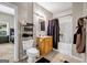 Modest bathroom with neutral tiles, a wooden vanity, and a shower with a patterned curtain at 803 Baugh Springs Ln, Lawrenceville, GA 30044
