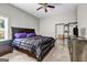 Bedroom with a large bed, neutral walls, and a ceiling fan, creating a restful ambiance at 803 Baugh Springs Ln, Lawrenceville, GA 30044