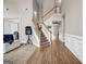 Spacious foyer featuring a staircase with white banisters and wood flooring at 803 Baugh Springs Ln, Lawrenceville, GA 30044