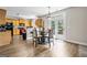 Bright kitchen with stainless appliances, wood cabinets, and eat-in breakfast nook near the door to the deck at 803 Baugh Springs Ln, Lawrenceville, GA 30044
