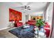 Bright living room featuring contemporary furnishings, vibrant artwork, and natural light from large window at 803 Baugh Springs Ln, Lawrenceville, GA 30044
