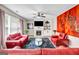 Comfortable living room with fireplace, built-in shelves, and cozy seating under a ceiling fan at 803 Baugh Springs Ln, Lawrenceville, GA 30044