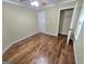 Bedroom featuring hardwood floors, neutral paint, and a closet, providing ample space and storage at 64 Shadow Ct, Palmetto, GA 30268