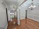 Elegant dining room showcasing hardwood floors, decorative molding, and a stylish chandelier fixture at 64 Shadow Ct, Palmetto, GA 30268