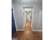 Hallway featuring beautiful hardwood floors and neutral paint, leading to other rooms in the house at 64 Shadow Ct, Palmetto, GA 30268