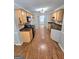 Well-lit kitchen with ample counter space and hardwood flooring at 64 Shadow Ct, Palmetto, GA 30268