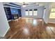Spacious living room with a fireplace, built-in shelves, and three windows at 64 Shadow Ct, Palmetto, GA 30268
