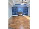 Large living room featuring a fireplace flanked by built-in bookshelves at 64 Shadow Ct, Palmetto, GA 30268