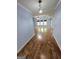 Open-concept living area boasts tray ceilings and hardwood floors at 64 Shadow Ct, Palmetto, GA 30268