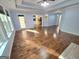 Bright living room with hardwood flooring and a view to the kitchen at 64 Shadow Ct, Palmetto, GA 30268