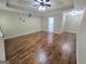 Spacious bedroom featuring wood floors, neutral walls and a ceiling fan at 64 Shadow Ct, Palmetto, GA 30268