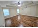Spacious bedroom featuring wood floors, neutral walls and a ceiling fan at 64 Shadow Ct, Palmetto, GA 30268
