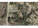 Aerial view shows property lines of land covered in trees at 2450 Highway 155 N, Mcdonough, GA 30252