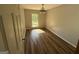 Bedroom boasts gleaming hardwood floors and natural light from a window at 2450 Highway 155 N, Mcdonough, GA 30252