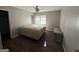 Bedroom with hardwood floors, ceiling fan, and natural light from the window at 2450 Highway 155 N, Mcdonough, GA 30252