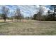 A large front yard with a driveway leads to the home at 2450 Highway 155 N, Mcdonough, GA 30252