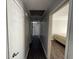 Hallway leads to rooms with doors and neutral walls at 2450 Highway 155 N, Mcdonough, GA 30252