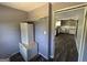View of the kitchen from an adjacent room, showcasing a large opening at 2450 Highway 155 N, Mcdonough, GA 30252