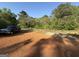 Large lot with trees and truck parked on the side at 2450 Highway 155 N, Mcdonough, GA 30252
