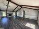 Open living room with a fireplace and wooden floors at 2450 Highway 155 N, Mcdonough, GA 30252