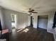 Main bedroom with hardwood floors, ceiling fan, and attached bathroom and closet at 2450 Highway 155 N, Mcdonough, GA 30252