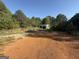 Rural view of the storage shed surrounded by trees and a large yard at 2450 Highway 155 N, Mcdonough, GA 30252