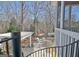 Spiral staircase leading to the backyard with a hot tub, pergola, and seating area at 319 Corrigan Trce, Peachtree City, GA 30269