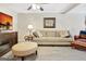 Comfortable finished basement with neutral tones, a cozy sofa, and an entertainment center at 319 Corrigan Trce, Peachtree City, GA 30269