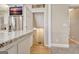 Basement wet bar area with stainless steel refrigerator, granite countertops and a walk-in storage area at 319 Corrigan Trce, Peachtree City, GA 30269