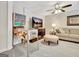Finished basement with a vintage pinball machine, a sofa, and a large screen TV, perfect for entertainment at 319 Corrigan Trce, Peachtree City, GA 30269