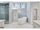 Bathroom featuring a glass shower, soaking tub, large window, and vanity at 319 Corrigan Trce, Peachtree City, GA 30269
