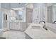 Spacious bathroom with dual vanities, bright lighting, and tile flooring, exuding modern elegance at 319 Corrigan Trce, Peachtree City, GA 30269