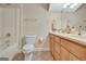 Bathroom features a vanity with a mirror, shower, and tiled flooring at 319 Corrigan Trce, Peachtree City, GA 30269