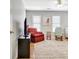 Comfortable bedroom featuring a plush armchair, rocker and flat screen TV at 319 Corrigan Trce, Peachtree City, GA 30269