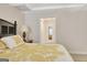 Cozy bedroom with neutral carpet and light-colored walls looking into the bathroom at 319 Corrigan Trce, Peachtree City, GA 30269